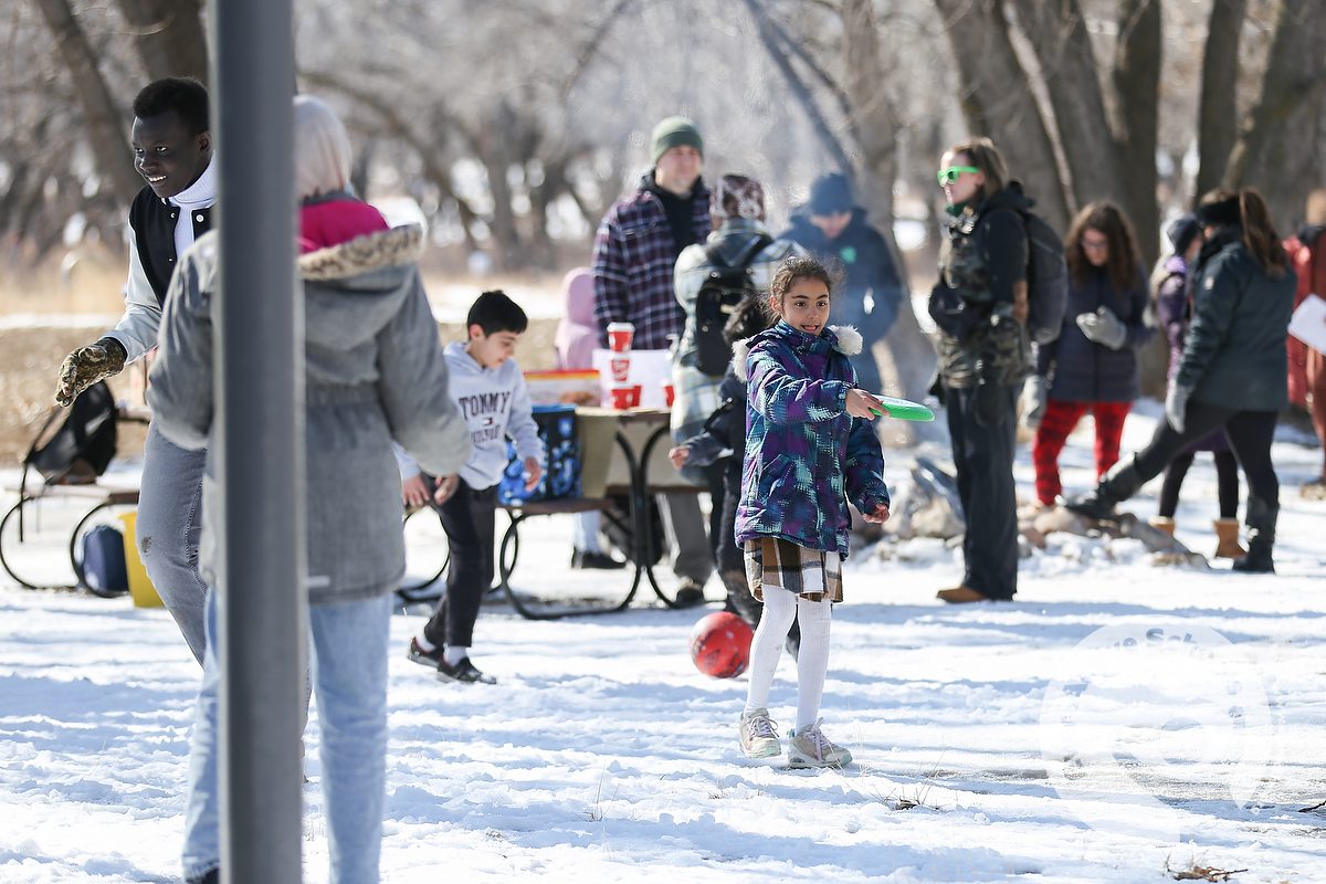 A new Canadian child throws a frisbee at Police Point Park in Medicine Hat, Alta.