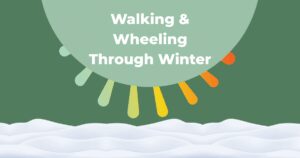 "Walking & Wheeling Through Winter" in a green semi-circle with a snowbank covering the bottom third