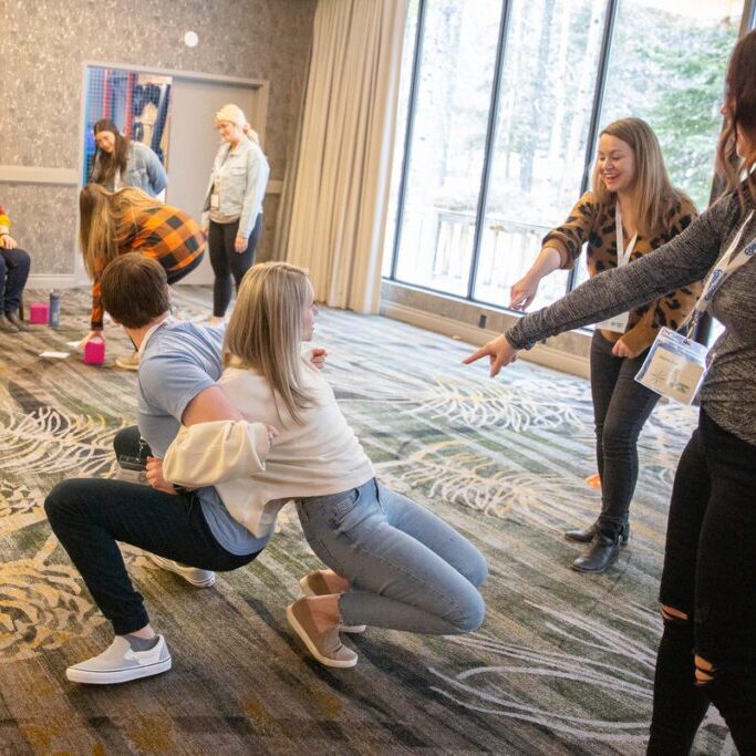 Teachers participating in workshops and games to support professional development